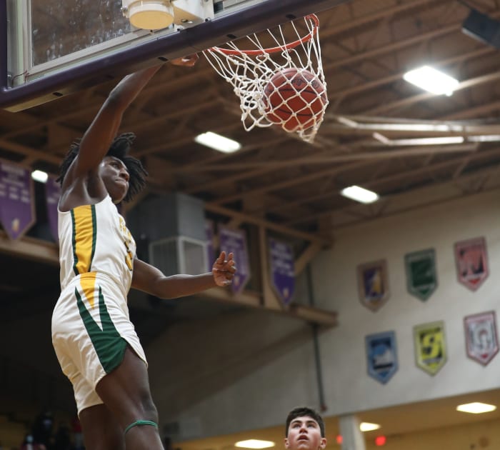 Taft guard Rayvon Griffith dunks during the Senators' regional final win over Springfield Shawnee, Saturday, March 13, 2021. Taft18